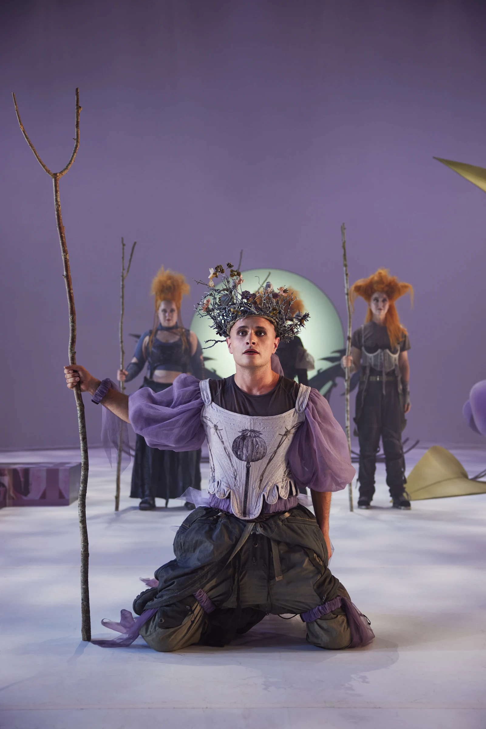 Backanterna — performer wearing a floral headdress, with ensemble behind