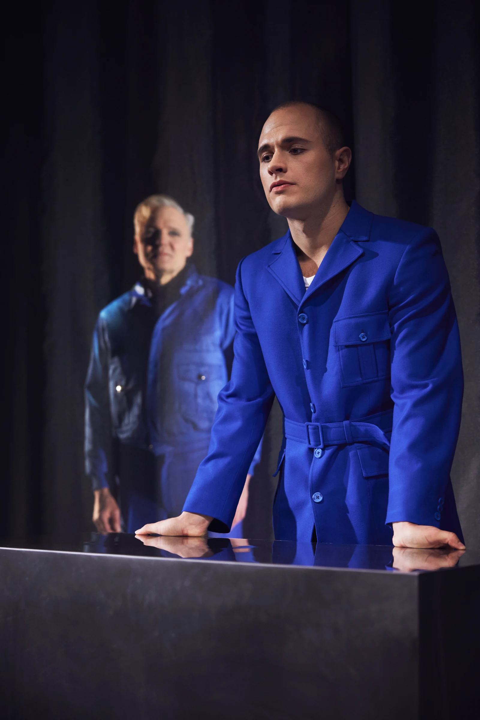 Kristinvariationer — performers in blue costumes beside a table